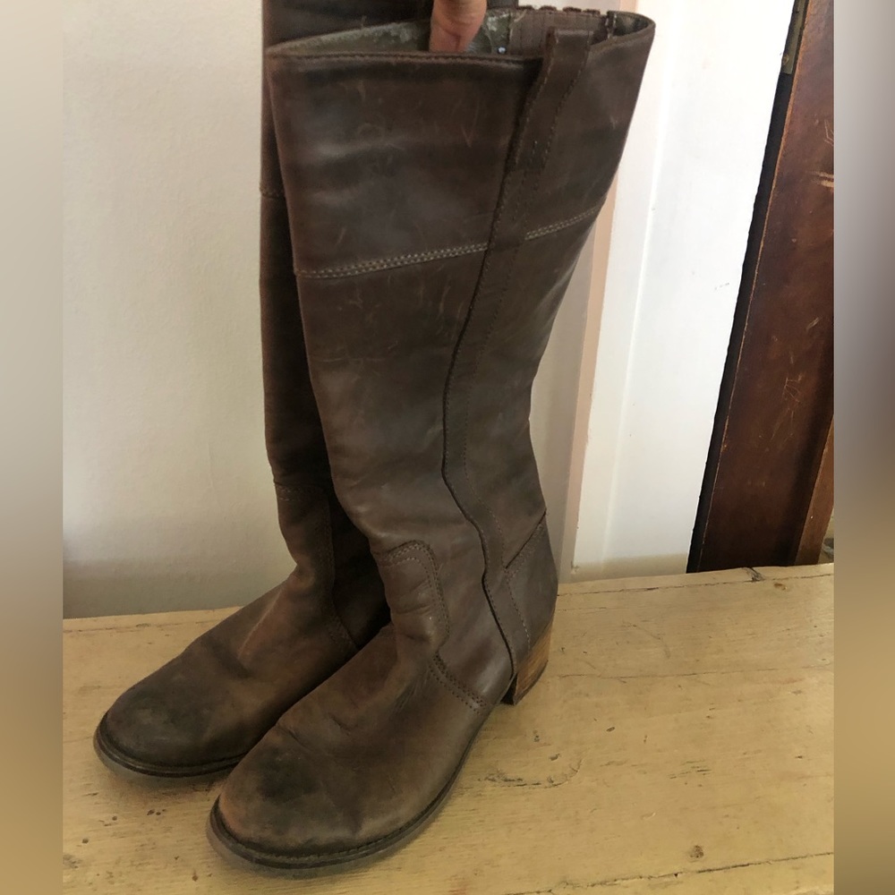Short heel tall distressed leather boots